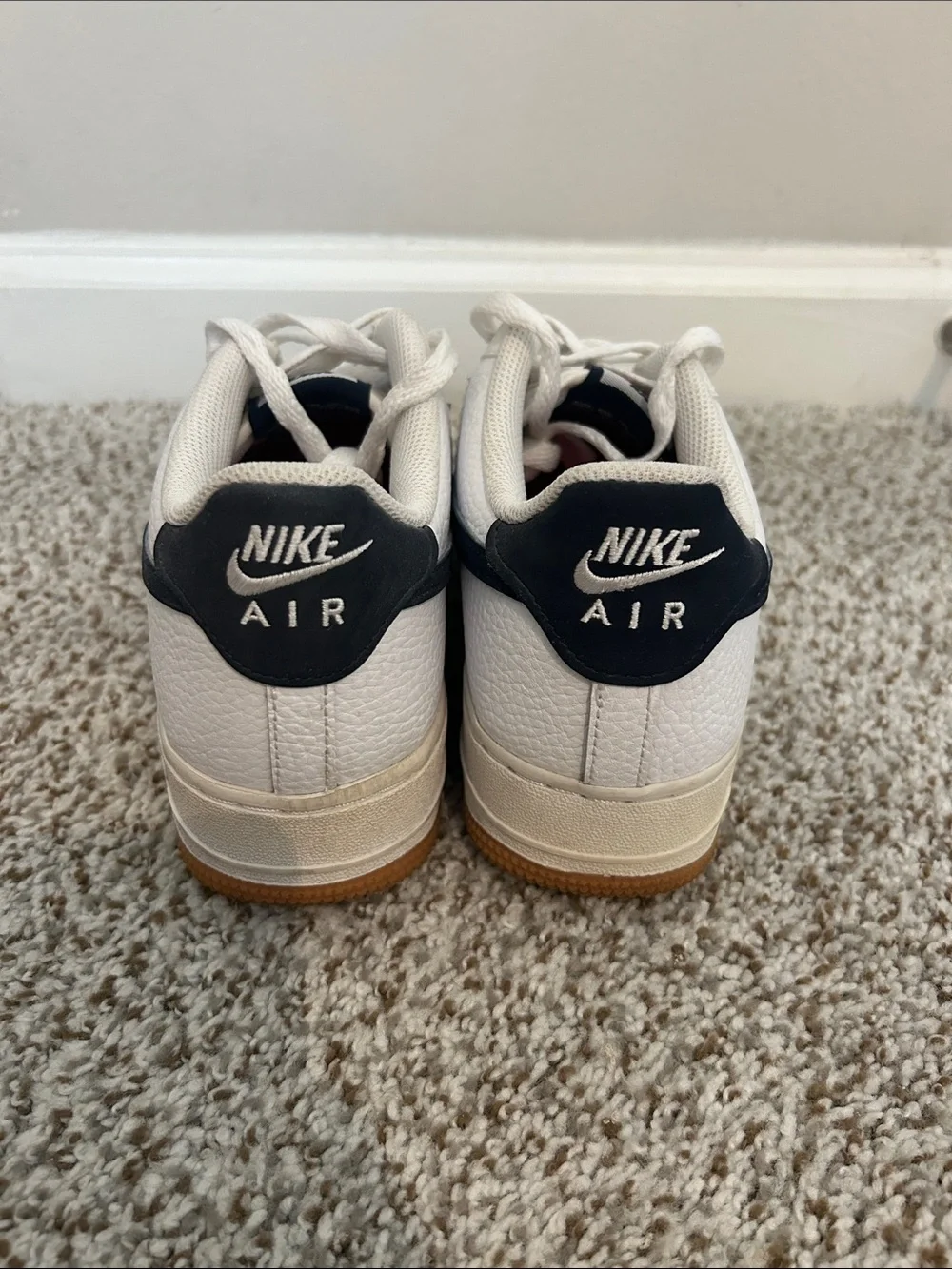 Nike Kids White Sneakers with Black Swoosh and Gum Sole